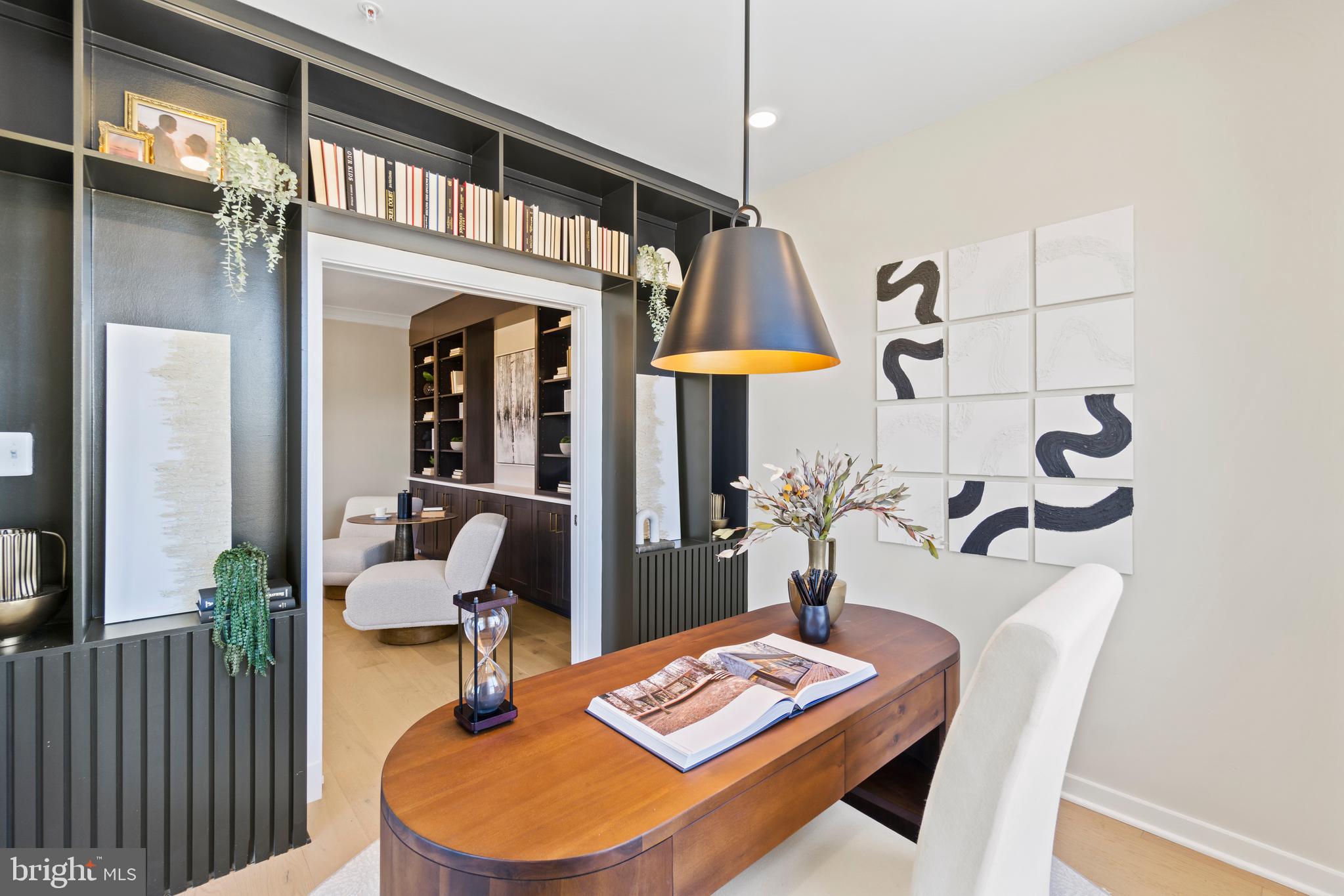 129 Summit Point Boulevard, Unit 11J Bowie, MD 20716 - Photo 11 of 45 a dining room with furniture a rug and wooden floor
