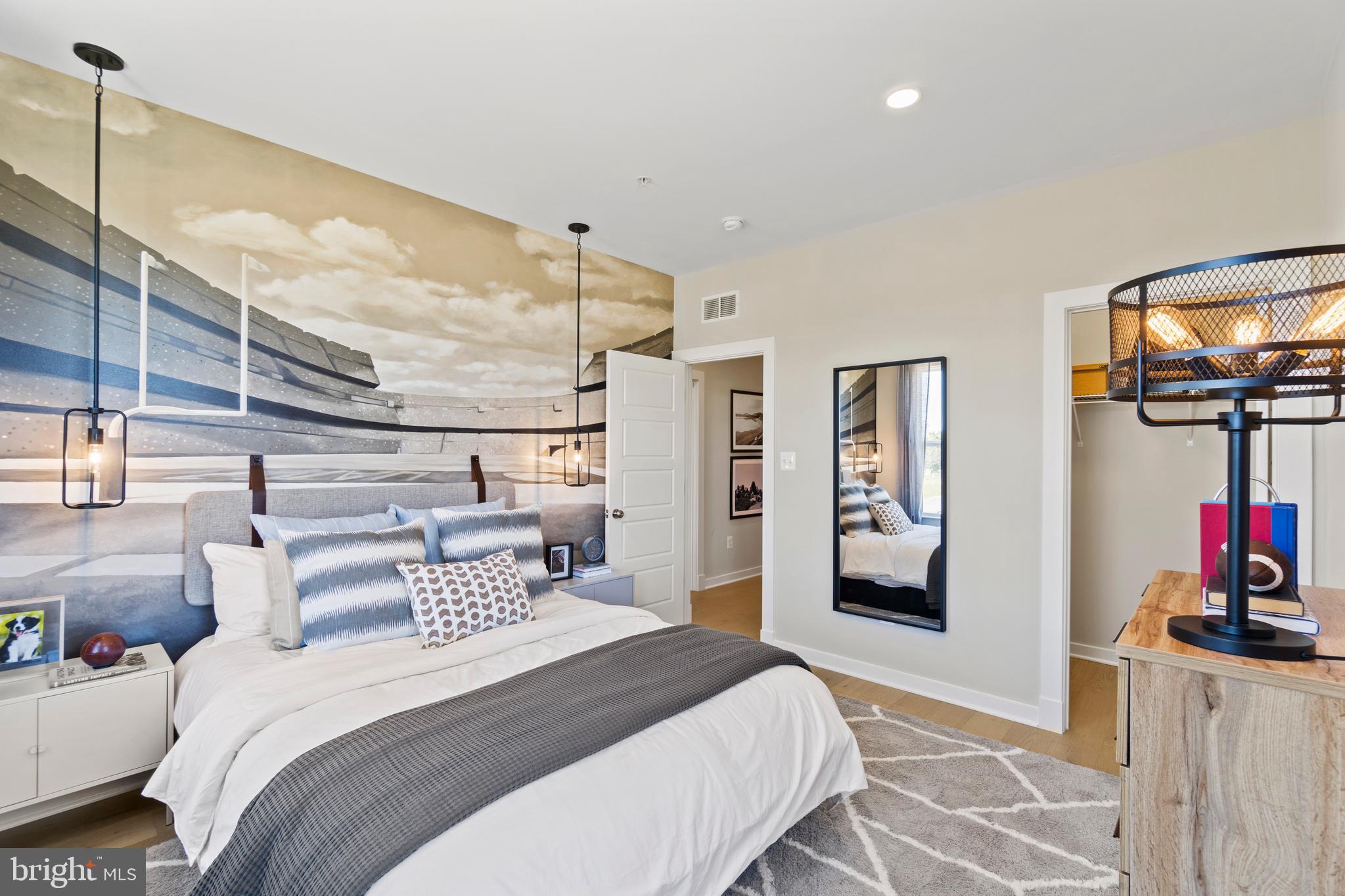 129 Summit Point Boulevard, Unit 11J Bowie, MD 20716 - Photo 19 of 45 a bedroom with a bed and glass wall