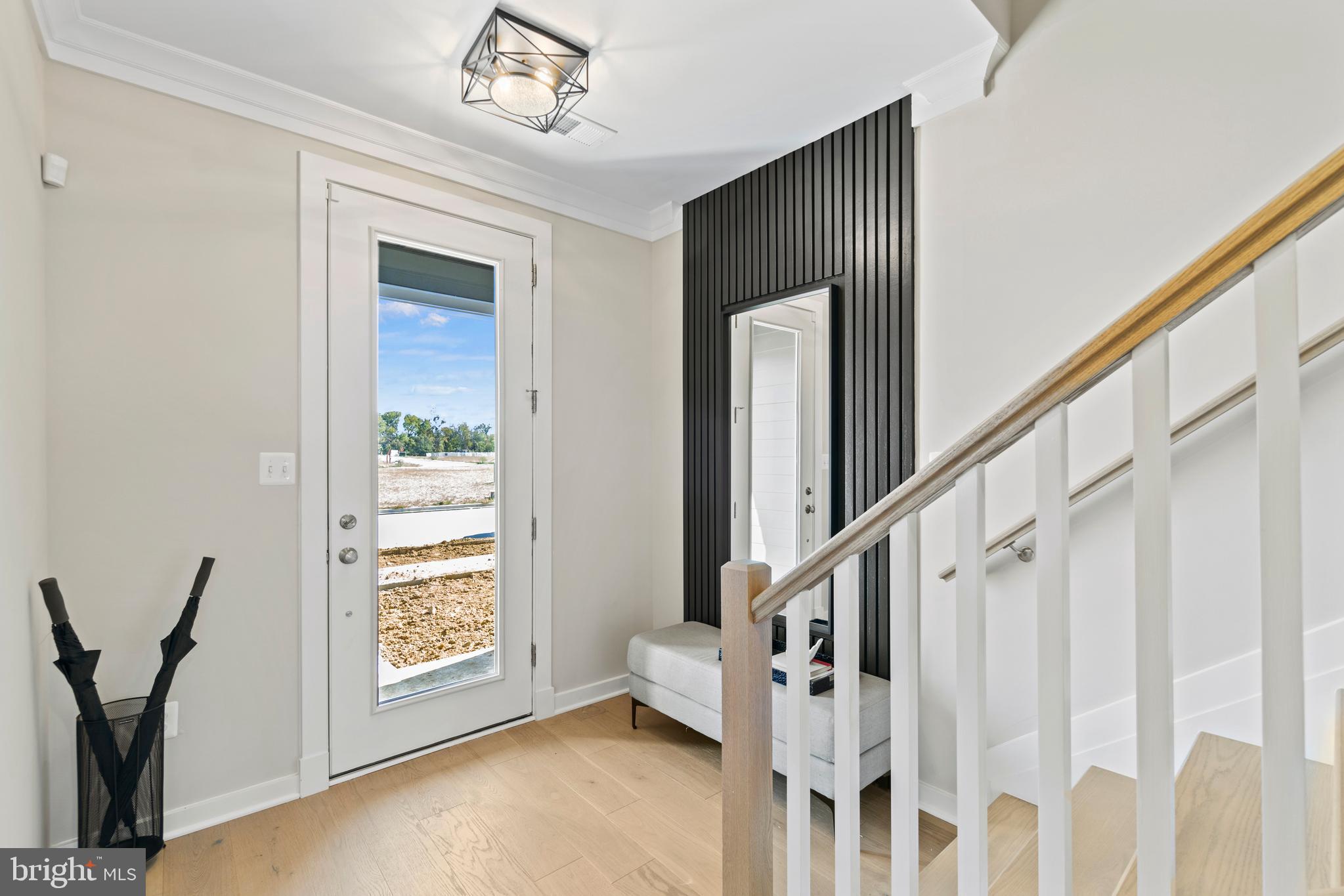 129 Summit Point Boulevard, Unit 11J Bowie, MD 20716 - Photo 30 of 45 a view of an entryway with wooden floor
