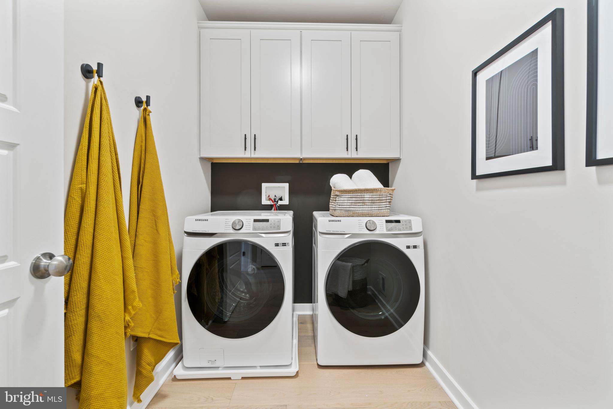 129 Summit Point Boulevard, Unit 11J Bowie, MD 20716 - Photo 33 of 45 a utility room with dryer and washer
