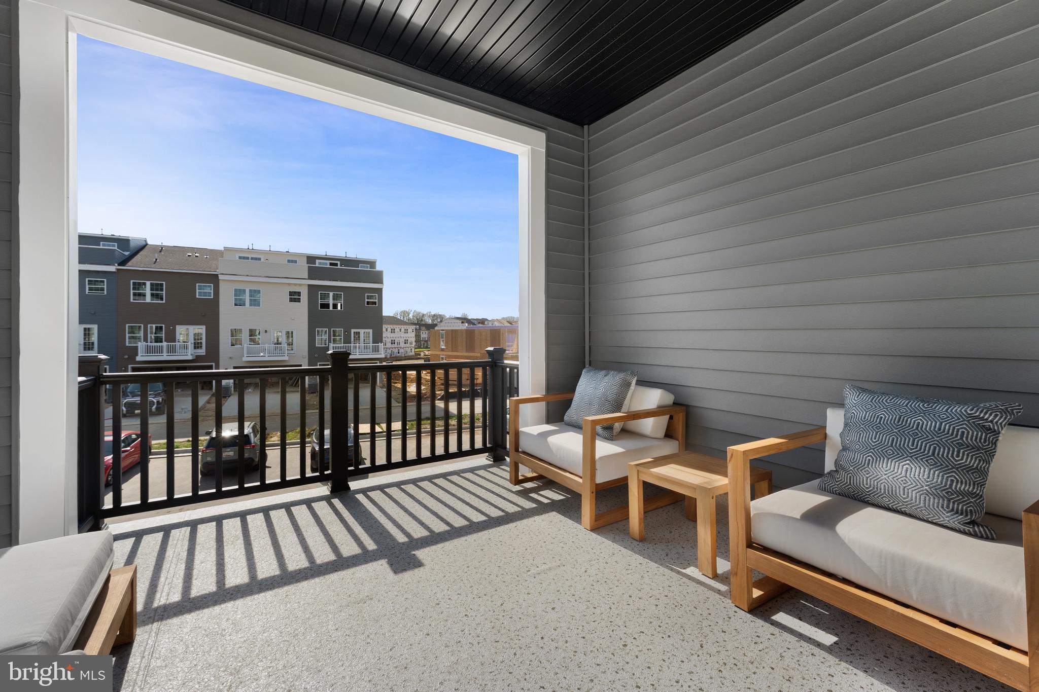 129 Summit Point Boulevard, Unit 11J Bowie, MD 20716 - Photo 43 of 45 a view of a balcony with furniture