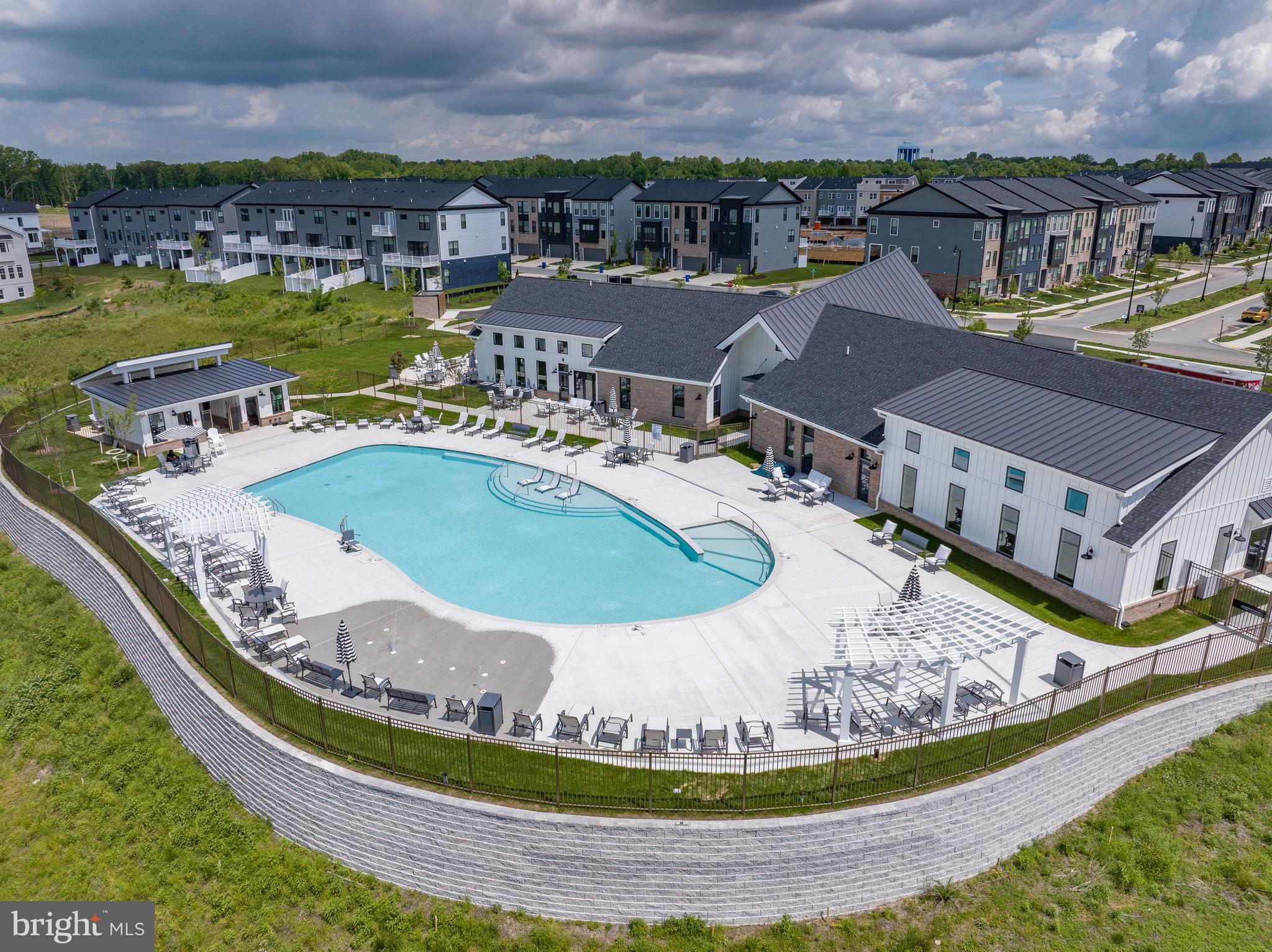 129 Summit Point Boulevard, Unit 11J Bowie, MD 20716 - Photo 45 of 45 a view of a swimming pool with a lake