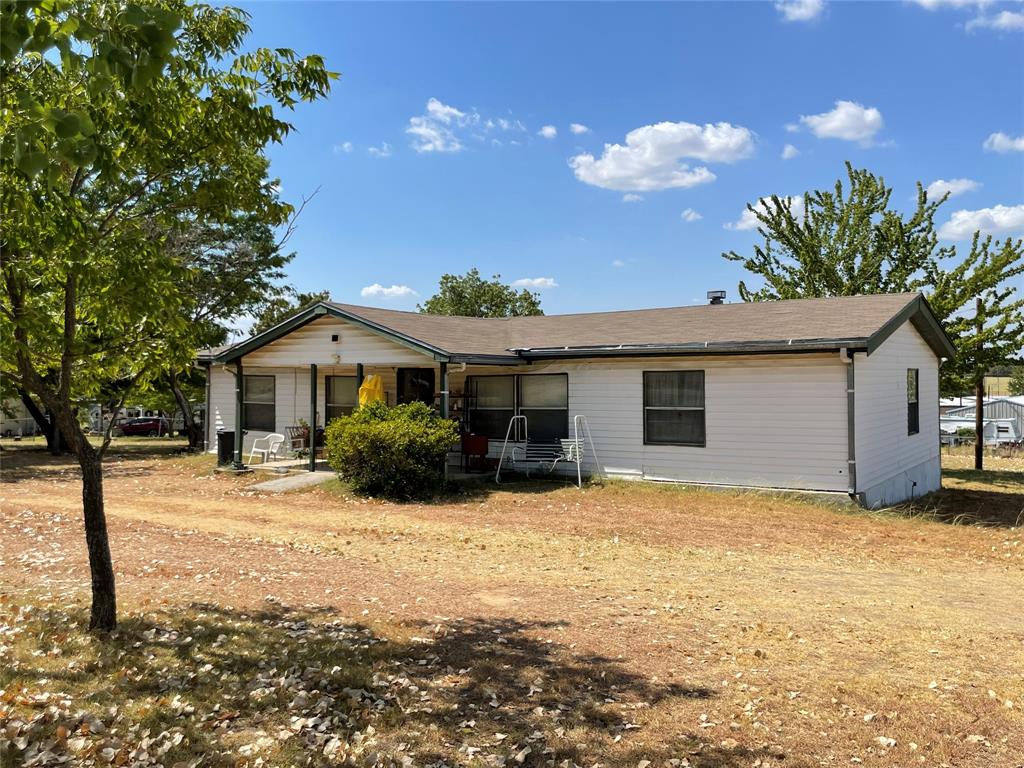 a view of a house with snow on the background