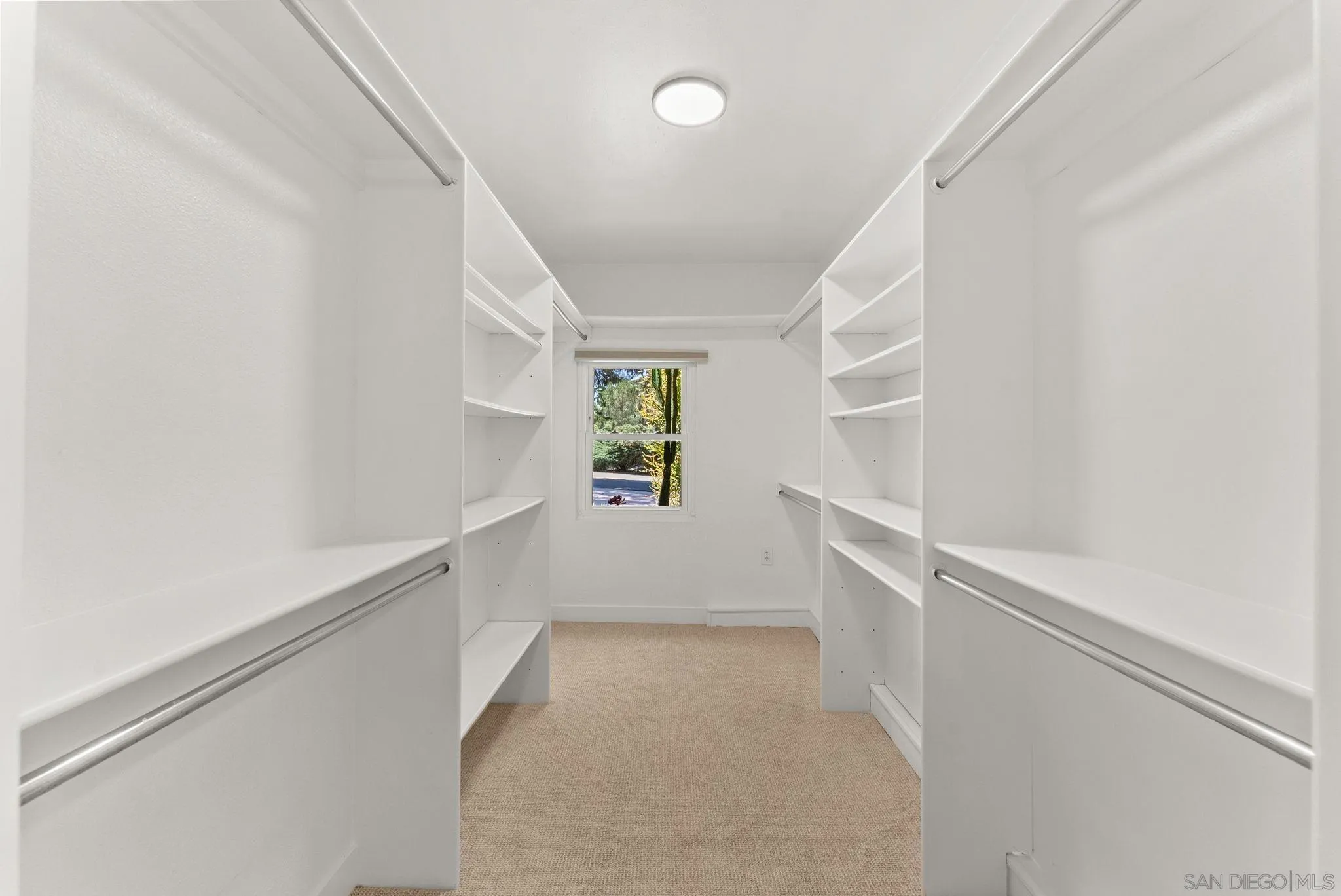 12832 Stone Canyon Road Poway, CA 92064 - Photo 30 of 60 a view of walk in closet with empty racks