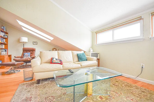 a living room with furniture and a rug