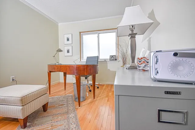 a living room with furniture a table and a large window