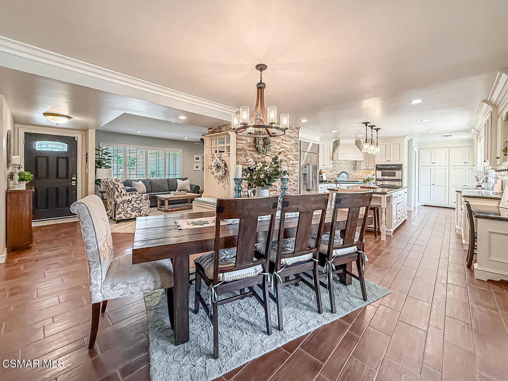 3116 Lori Circle Simi Valley, CA 93063 - Photo 14 of 74 a dining room with furniture a chandelier and wooden floor