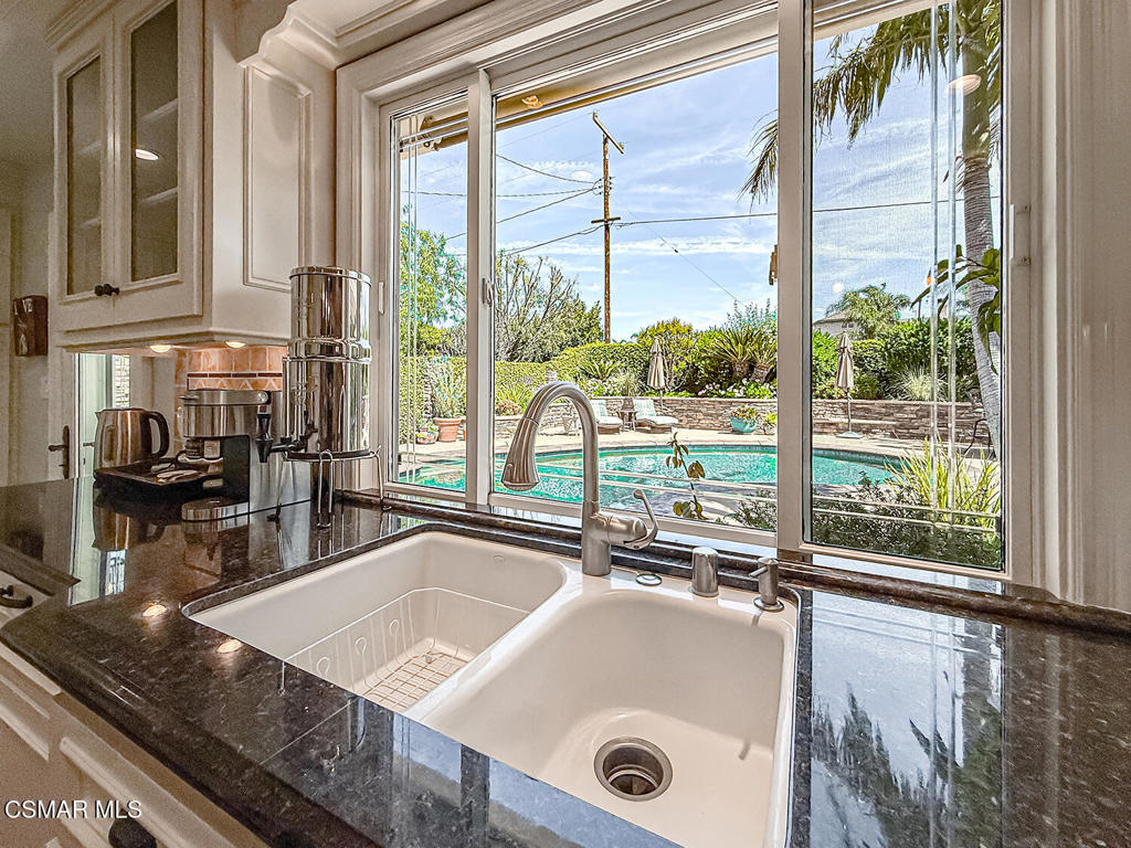 3116 Lori Circle Simi Valley, CA 93063 - Photo 17 of 74 a view of a kitchen with kitchen island a large window in it