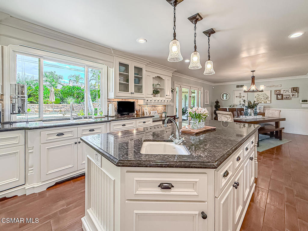 3116 Lori Circle Simi Valley, CA 93063 - Photo 21 of 74 a kitchen with stainless steel appliances granite countertop a sink a stove and a large window
