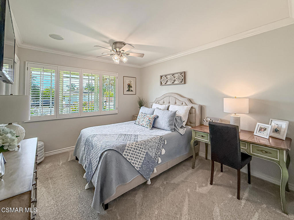 3116 Lori Circle Simi Valley, CA 93063 - Photo 27 of 74 a bedroom with a bed table chair and a window