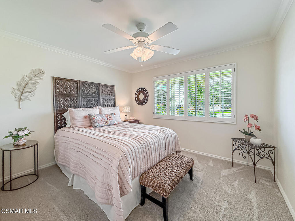 3116 Lori Circle Simi Valley, CA 93063 - Photo 29 of 74 a bedroom with a bed and a chandelier