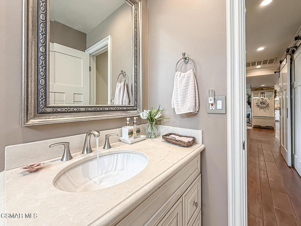 3116 Lori Circle Simi Valley, CA 93063 - Photo 32 of 74 a bathroom with a sink and a mirror