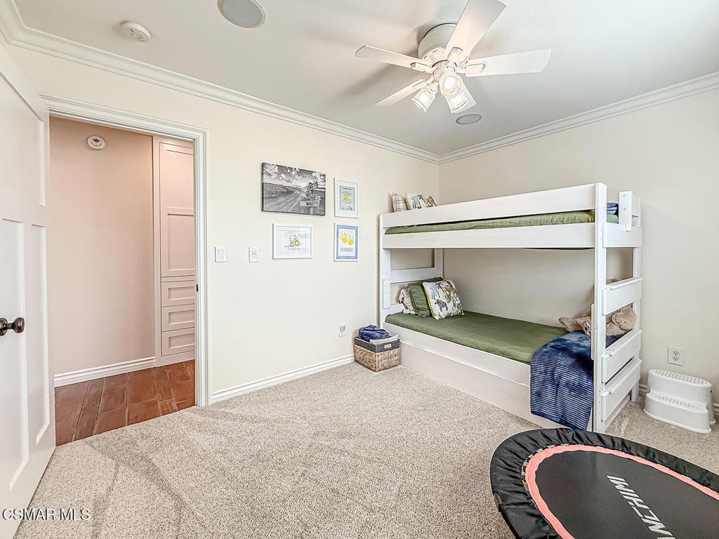 3116 Lori Circle Simi Valley, CA 93063 - Photo 34 of 74 a bedroom with a bed and a chandelier