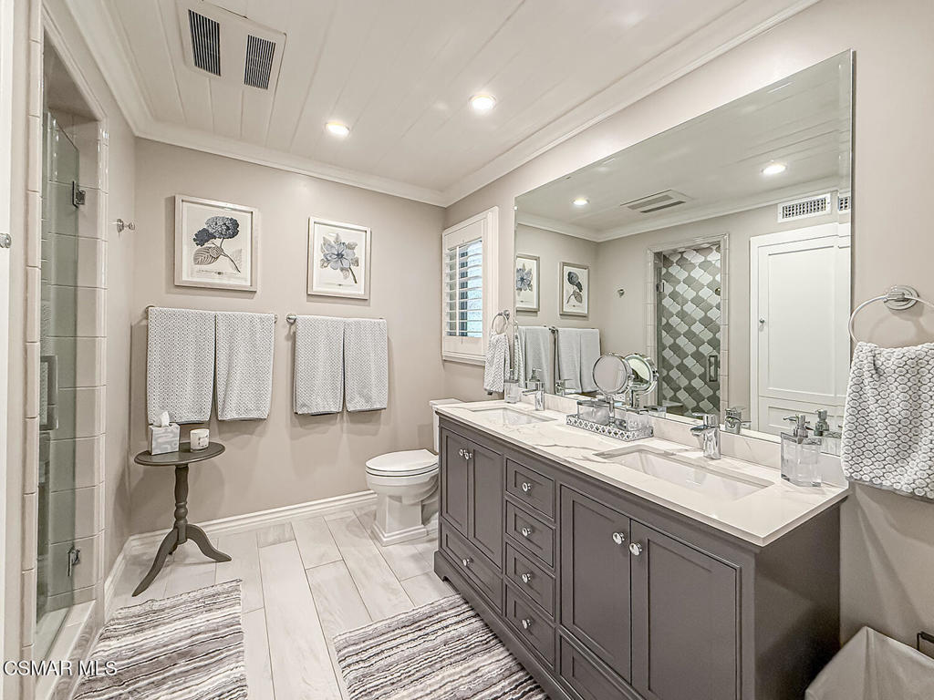 3116 Lori Circle Simi Valley, CA 93063 - Photo 35 of 74 a spacious bathroom with a double vanity sink a toilet and a mirror