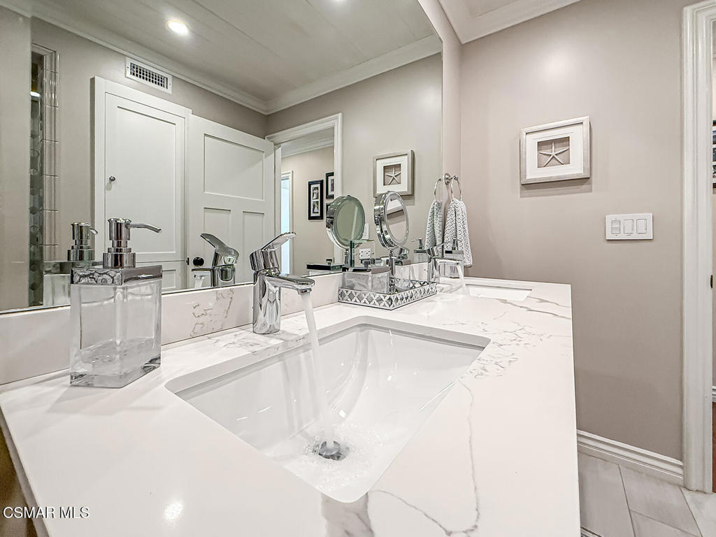 3116 Lori Circle Simi Valley, CA 93063 - Photo 36 of 74 a bathroom with double vanity sinks and a mirror
