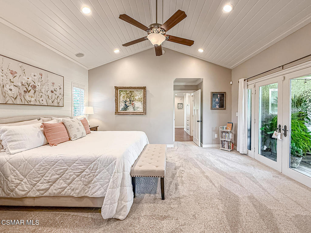 3116 Lori Circle Simi Valley, CA 93063 - Photo 42 of 74 a spacious bedroom with a large bed and a chandelier