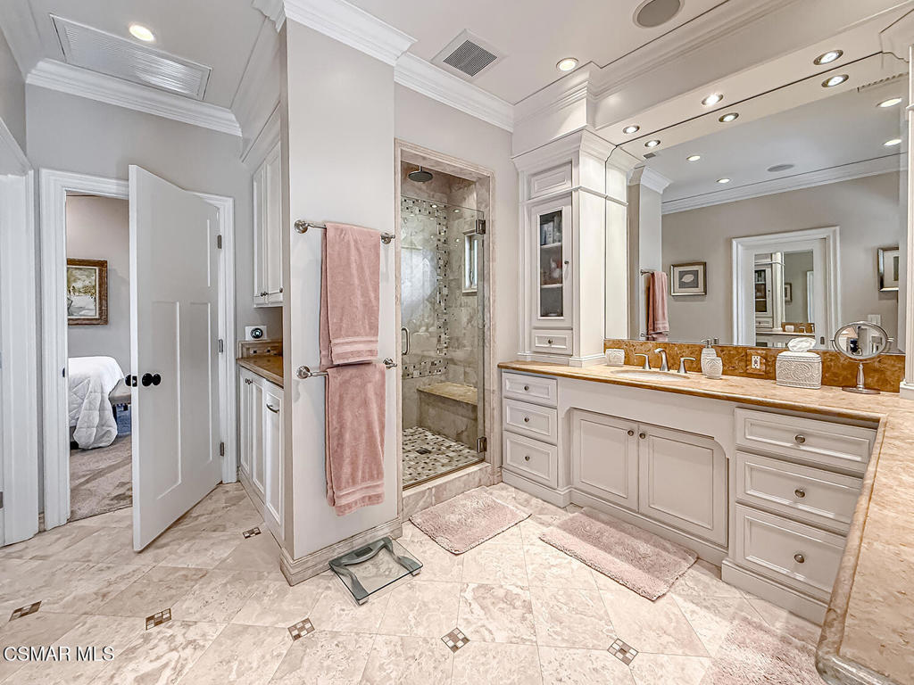 3116 Lori Circle Simi Valley, CA 93063 - Photo 43 of 74 a spacious bathroom with a granite countertop sink mirror and shower