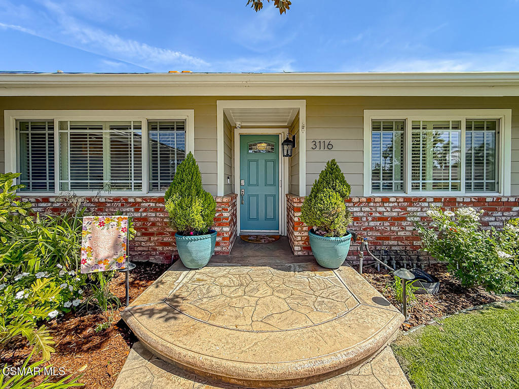 3116 Lori Circle Simi Valley, CA 93063 - Photo 6 of 74 front view of a house with potted plants
