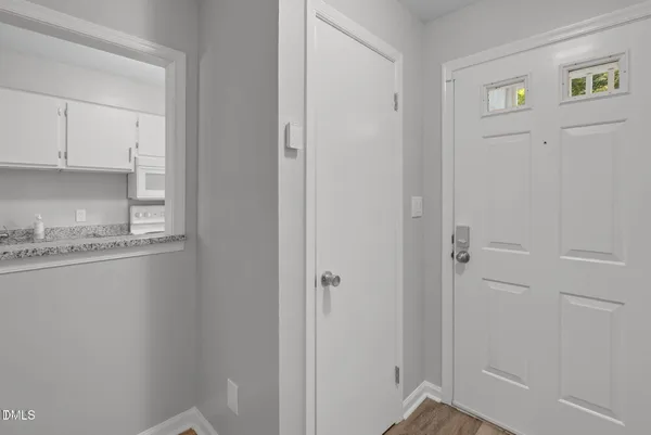 a bathroom with a granite countertop sink and cabinets