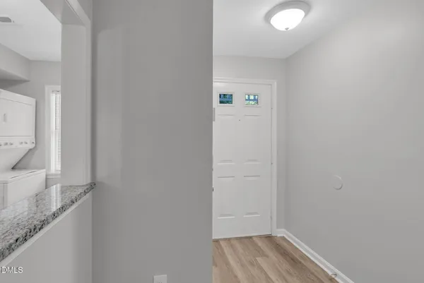 a view of hallway with wooden floor