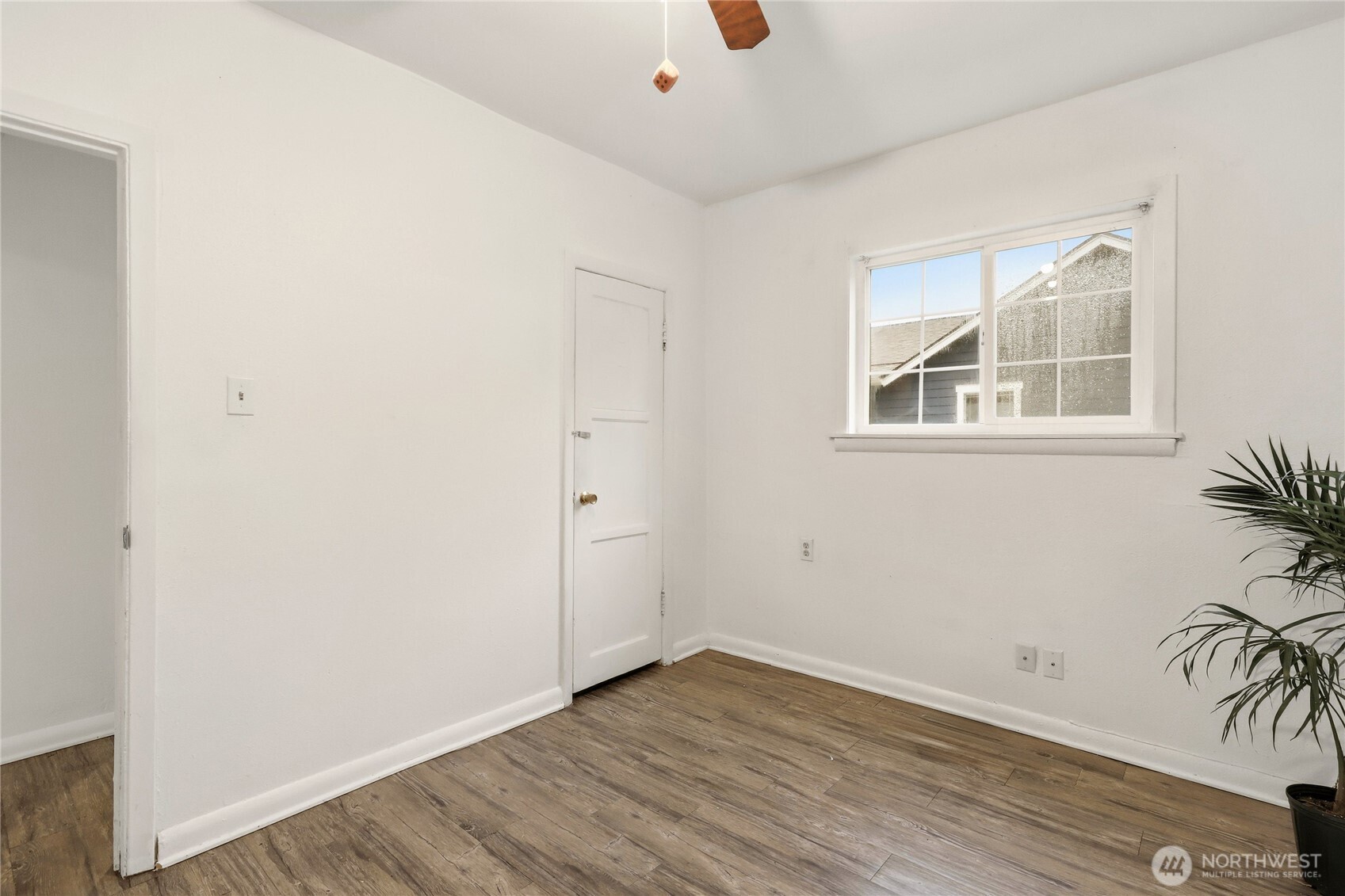 1505 Retsil Road Southeast Port Orchard, WA 98366 - Photo 11 of 19 an empty room with wooden floor and windows