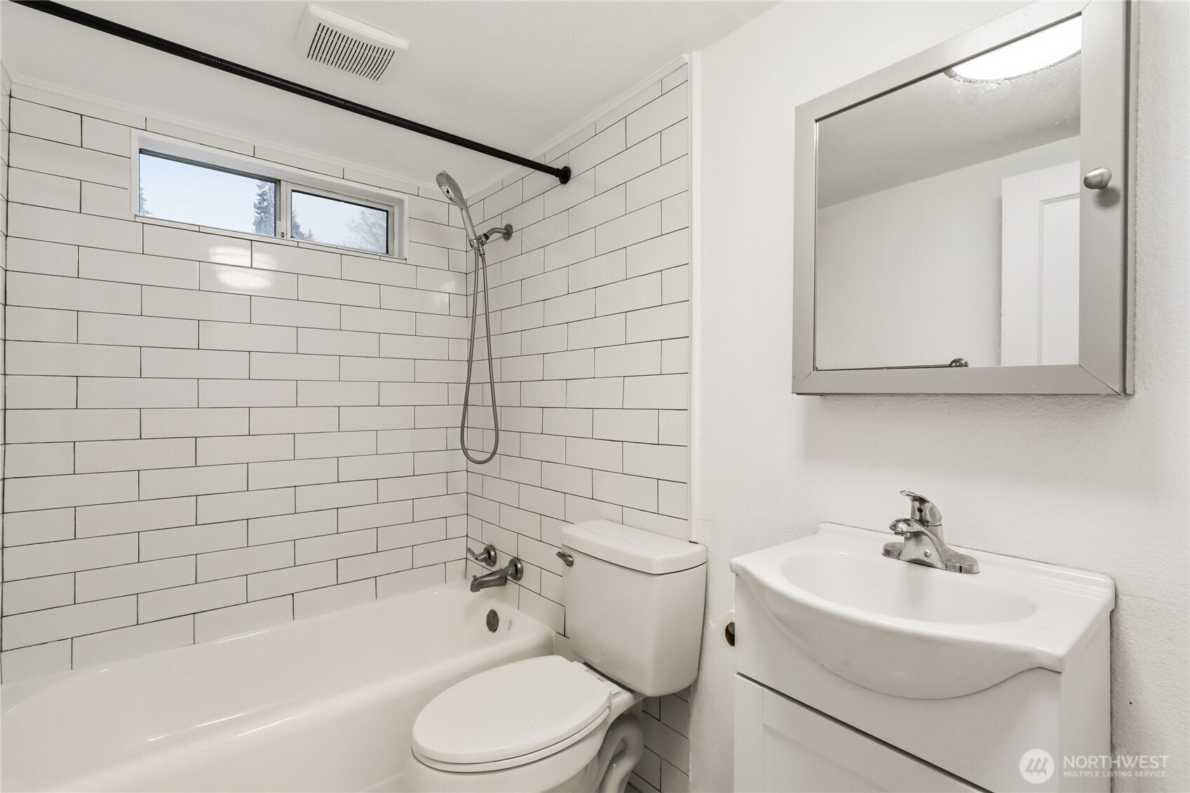 1505 Retsil Road Southeast Port Orchard, WA 98366 - Photo 16 of 19 a bathroom with a bathtub shower sink mirror vanity and toilet
