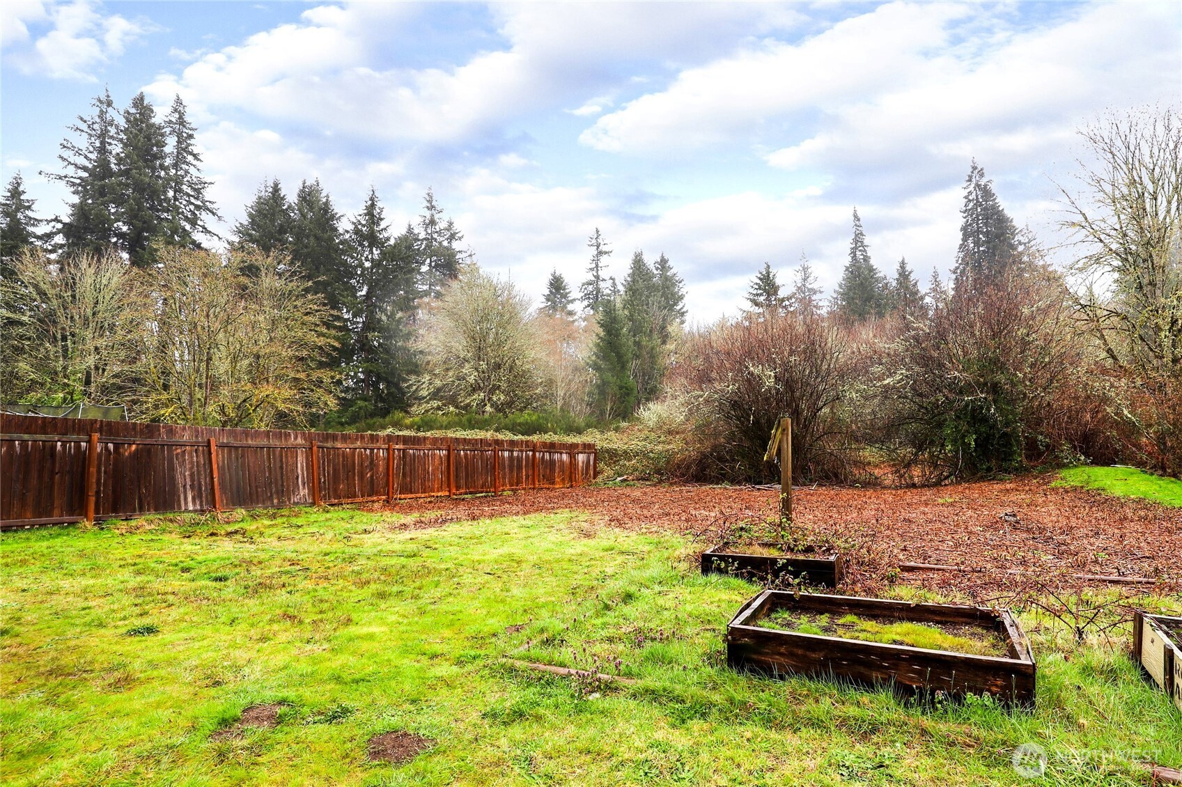 1505 Retsil Road Southeast Port Orchard, WA 98366 - Photo 18 of 19 a view of a backyard with a small cabin