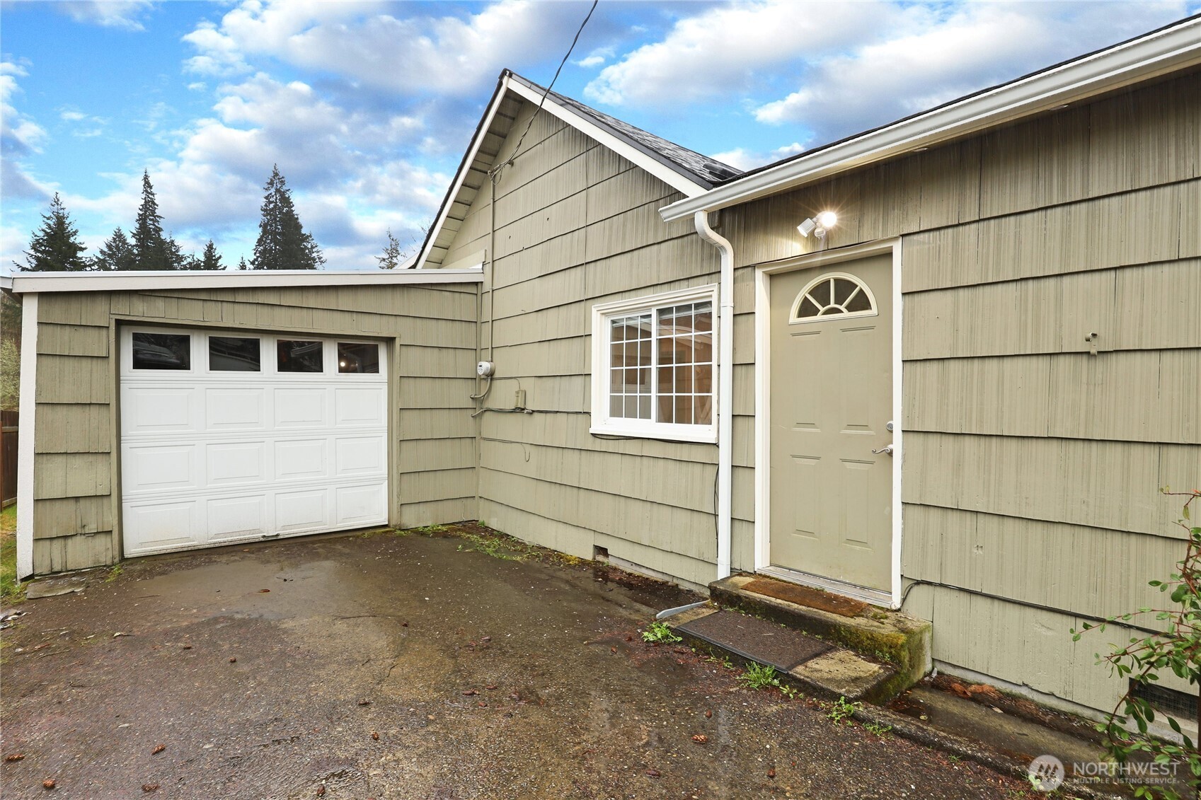 1505 Retsil Road Southeast Port Orchard, WA 98366 - Photo 2 of 19 a view of house with garage