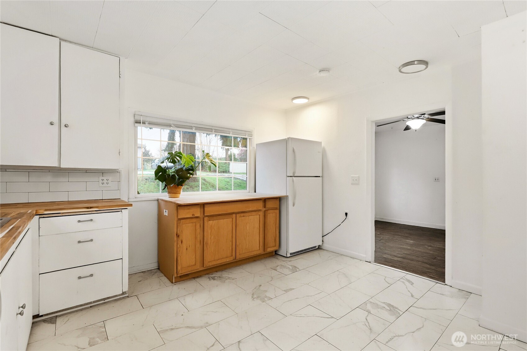 1505 Retsil Road Southeast Port Orchard, WA 98366 - Photo 9 of 19 a kitchen with granite countertop white cabinets and white appliances