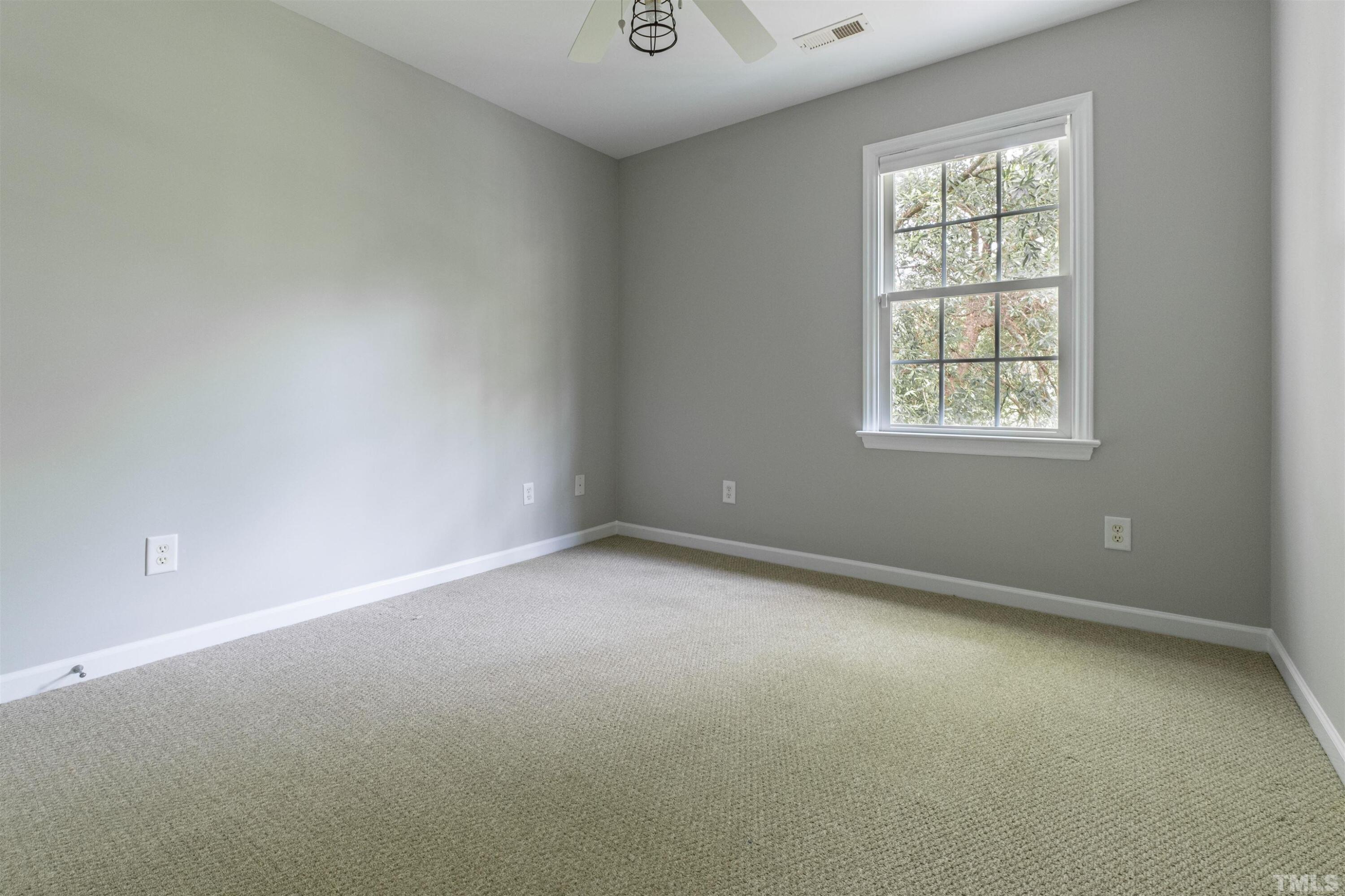 125 Old Grove Lane Apex, NC 27502 - Photo 12 of 30 an empty room with a window