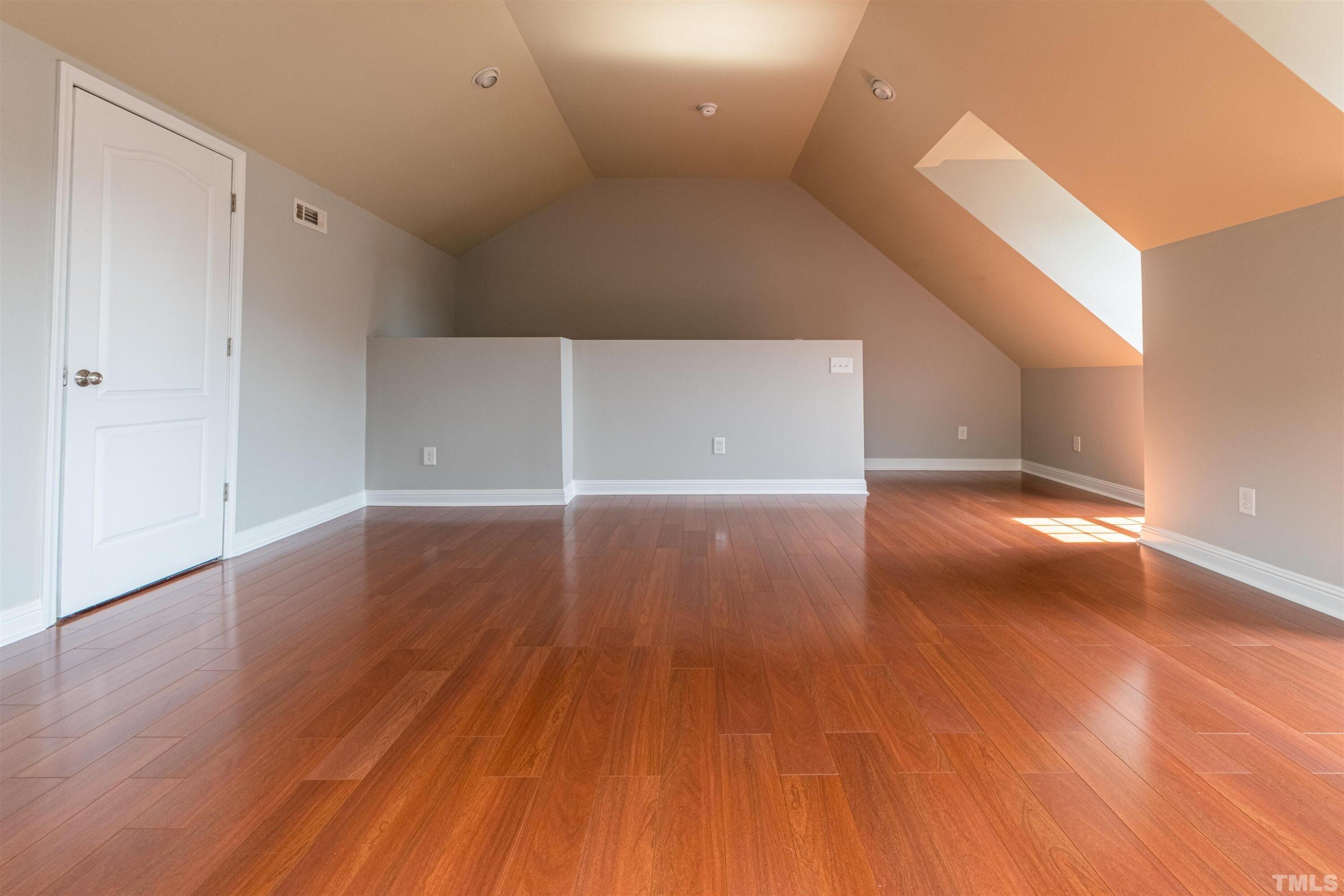 125 Old Grove Lane Apex, NC 27502 - Photo 22 of 30 a view of a hallway with wooden floor