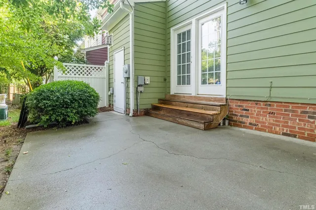 a view of backyard with large tree