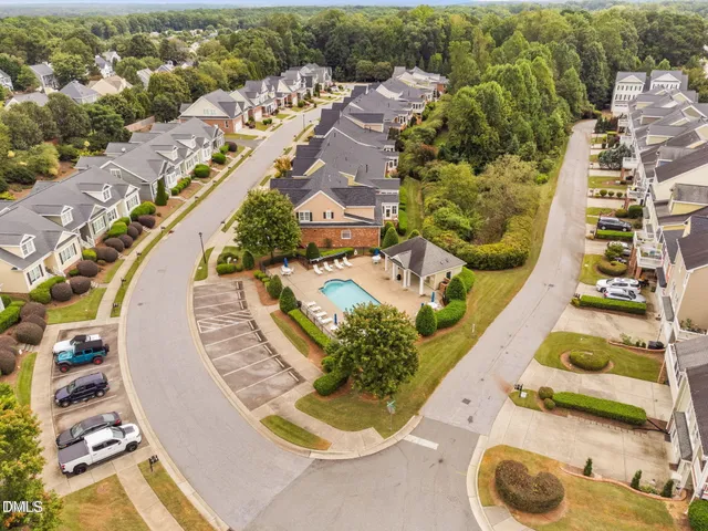 an aerial view of a house with a swimming pool
