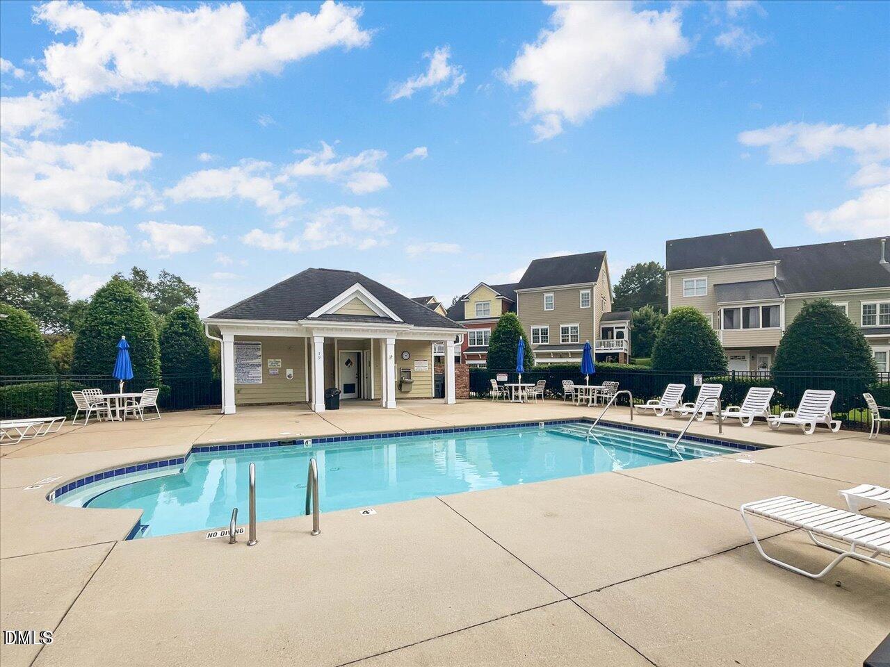 125 Old Grove Lane Apex, NC 27502 - Photo 27 of 30 a view of a house with swimming pool and a yard