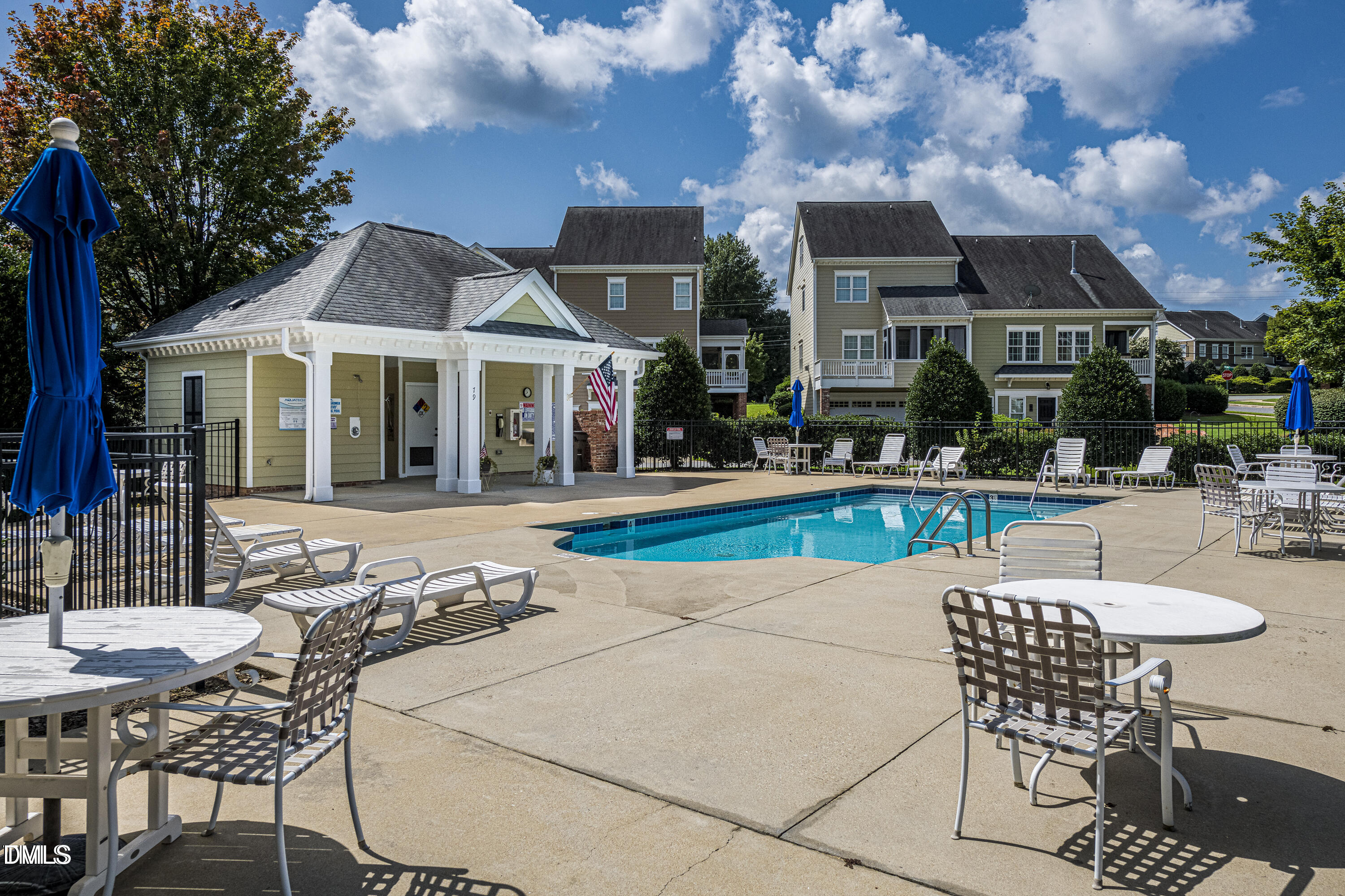 125 Old Grove Lane Apex, NC 27502 - Photo 28 of 30 a patio with table and chairs and potted plants
