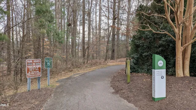 a sign board with parking area
