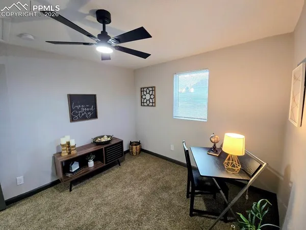 a living room with furniture and a window