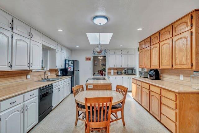 111 South Briaroaks Road Burleson, TX 76028 - Photo 17 of 39 a kitchen with stainless steel appliances granite countertop a kitchen island hardwood floor sink stove and granite counter top
