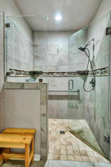 111 South Briaroaks Road Burleson, TX 76028 - Photo 28 of 39 a bathroom with a tub a toilet and a shower