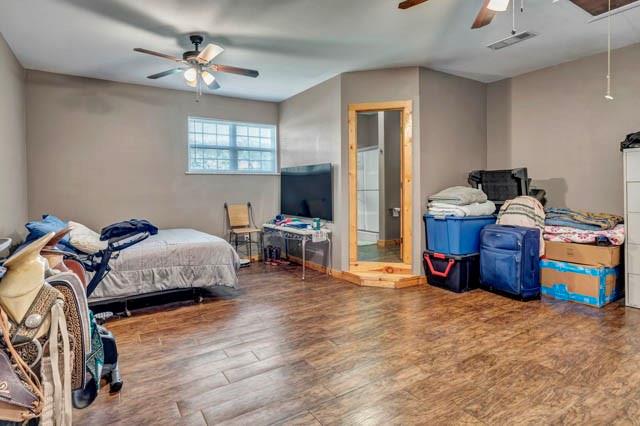 111 South Briaroaks Road Burleson, TX 76028 - Photo 31 of 39 a bed room with a bed and a tv