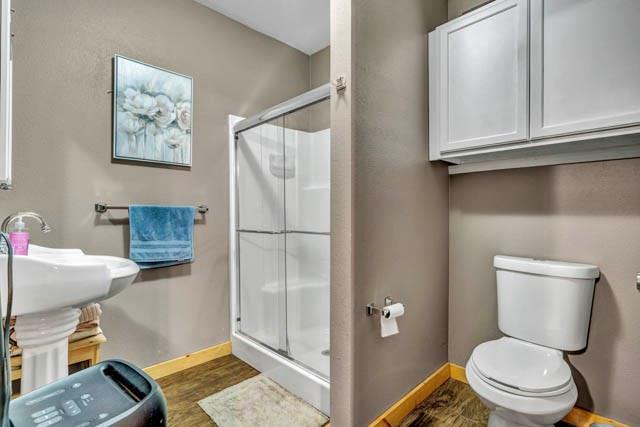 111 South Briaroaks Road Burleson, TX 76028 - Photo 33 of 39 a white toilet sitting next to a bathroom sink