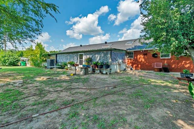 111 South Briaroaks Road Burleson, TX 76028 - Photo 35 of 39 a front view of a house with garden