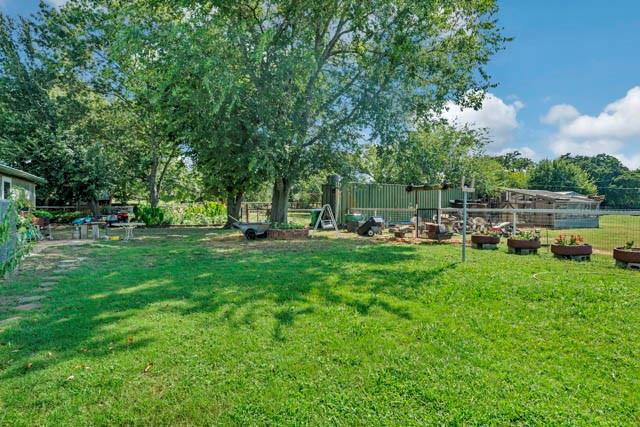 111 South Briaroaks Road Burleson, TX 76028 - Photo 37 of 39 a green field with lots of trees