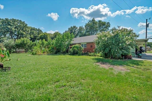 111 South Briaroaks Road Burleson, TX 76028 - Photo 38 of 39 a view of a yard with plants and large trees