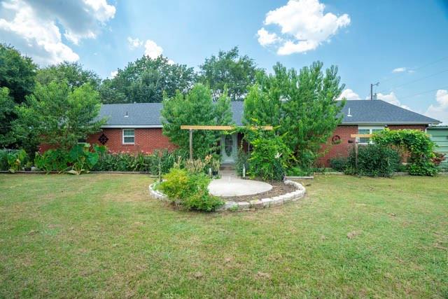 111 South Briaroaks Road Burleson, TX 76028 - Photo 4 of 39 a view of a house with a yard and basketball court