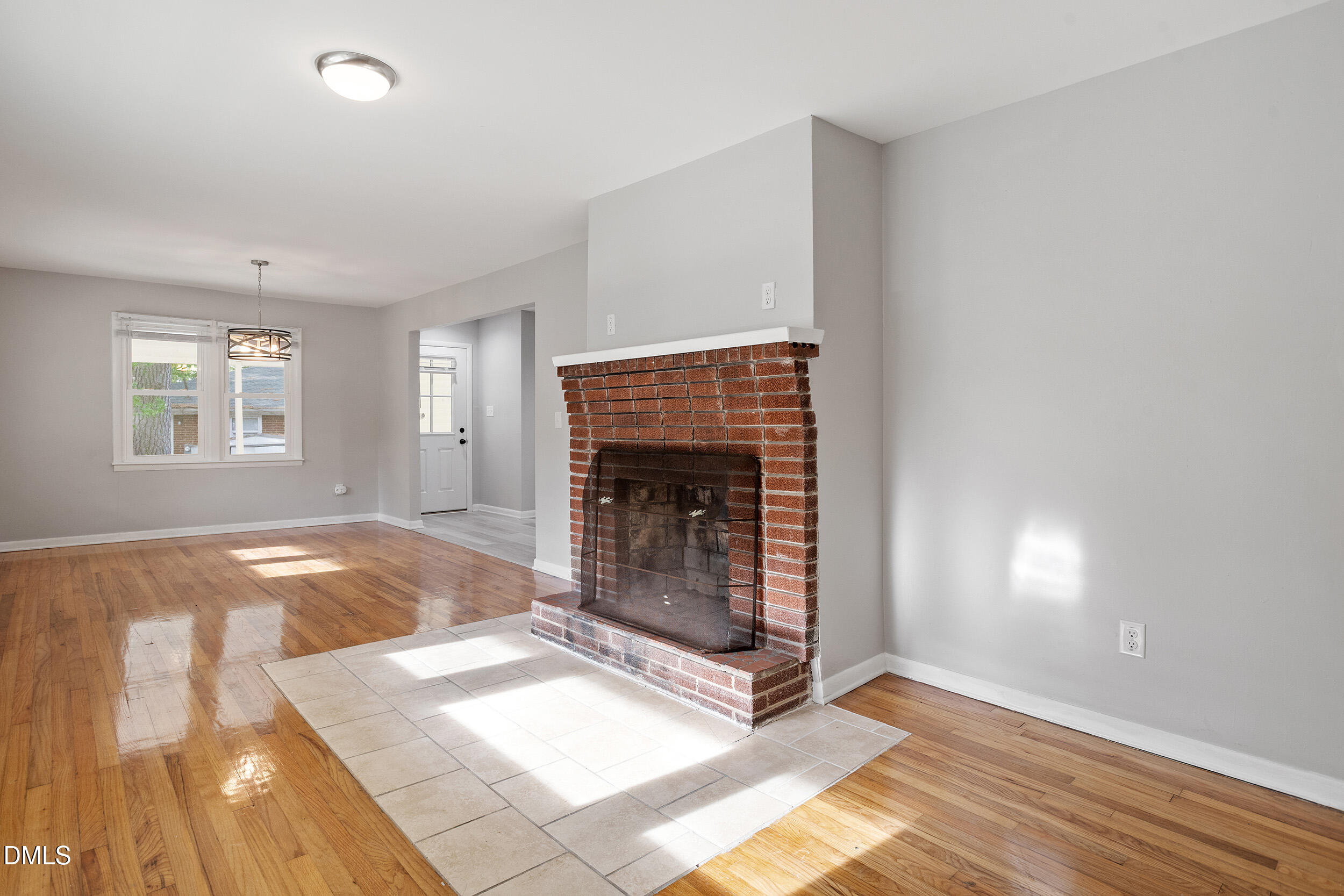 2414 Chapin Street Durham, NC 27707 - Photo 4 of 30 a view of livingroom with window and fireplace