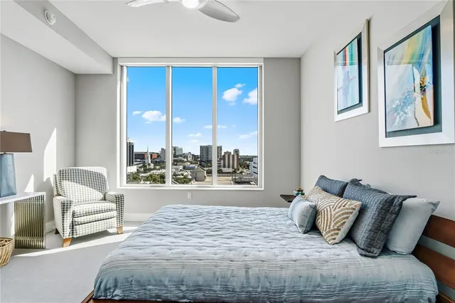 a bedroom with a large bed and a couch