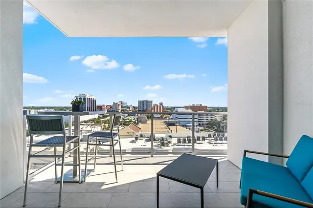 a view of a living room and kitchen