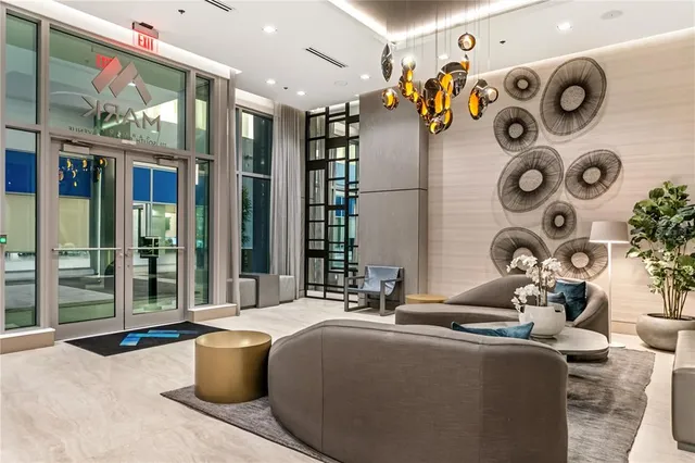 a living room with patio furniture and a mirror