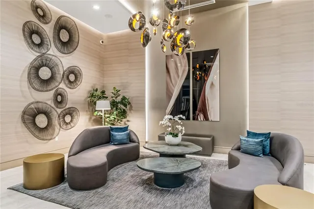 a living room with furniture and flowers